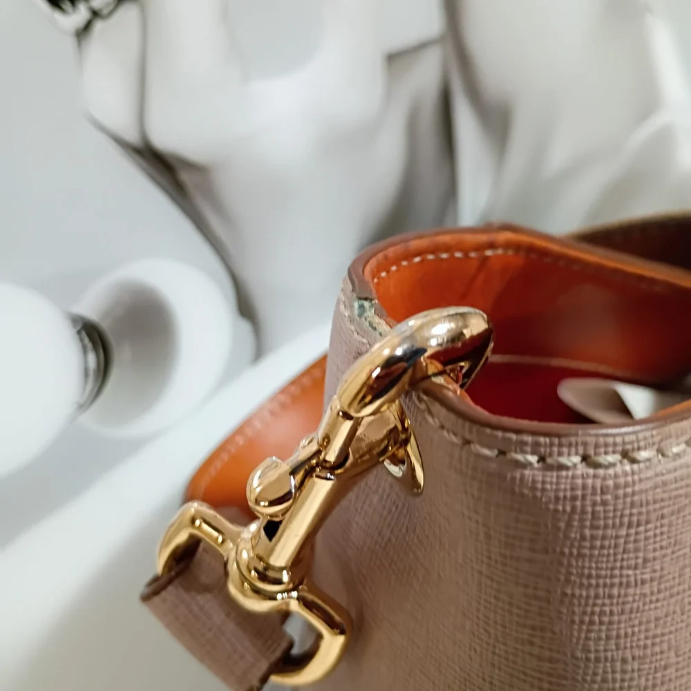 Dooney & Bourke Mauve Shoulder Bag with Gold Buckle